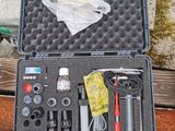 a case with tools in it sitting on a wooden bench