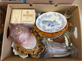 a box full of assorted items sitting on the floor