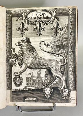 an old book with a picture of a lion on it ' s cover