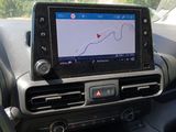 the dashboard of a car with a gps device in it