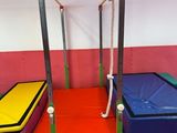 many different colored gymnastics mats in this room