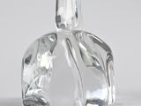 a clear glass bottle that is sitting on a table