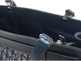 the inside of a blue handbag with a handle and a zipper