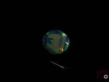 an image of a black background with a green and blue ball in the middle