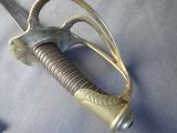 a close up of a sword on a table