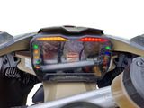 a close up of a motorcycle dashboard with a digital display