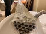 a plastic pipe sticking out of a sink in the bathroom