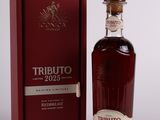 a bottle of whisky in front of a red box