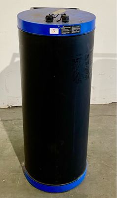a black trash can with a blue lid in a room