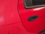 a red car that is parked in a parking lot
