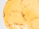 an image of a yellow glass ball on a white background