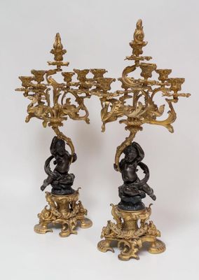 pair of antique bronze candelabs with figures on pedestals