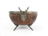 an image of a metal bowl with a deer head on it