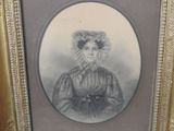 an old picture of a woman in a dress and bonnet in a gold frame