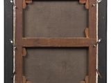 an old picture frame with a label on it
