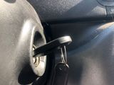 a car door handle that has a key in it