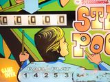 a close up of a pinball machine with a woman on it