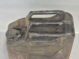 an old metal canister with a handle on it