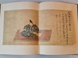 an open book with a picture of a cat and a bird on it