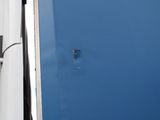a blue door and a white wall in a room