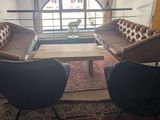 two chairs and a table in a living room