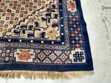 a rug on the floor with a cat laying on it