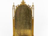 an antique brass mirror with a cross on the top of it