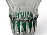a glass vase that has a green and white design on it