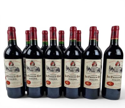 six bottles of red wine are lined up in a row