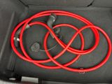a red hose in the trunk of a car