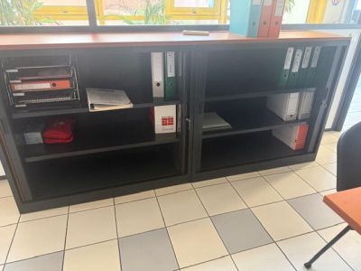 a desk with a bookcase and a chair in the room