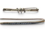 three different types of hair pins are shown on a white surface