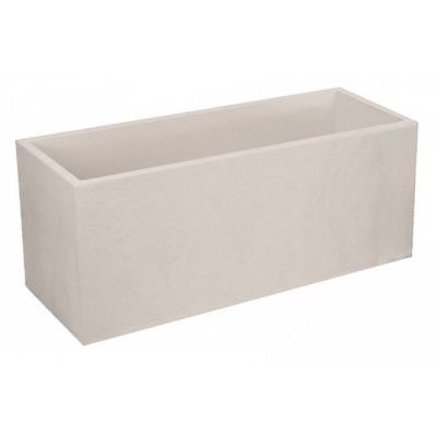 une photo d'une jardinière blanche posée sur une table blanche
