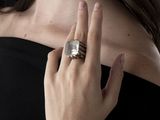 a woman with a ring on her finger and a ring on her hand