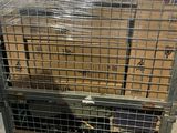a metal cage with a bunch of boxes inside of it