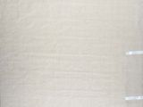 an image of a piece of linen with a piece of tape taped to it