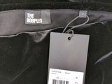 the koople label on a black jacket with a tag on it