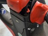 a close up of a gas pump on a scooter