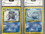 two pokemon trading cards are on display in a store