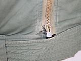 a close up of a person wearing a jacket with a zipper on it