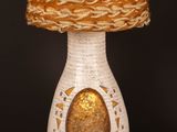 a lamp that is sitting on a table in front of a black background