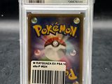 a close up of a pokemon card in a plastic case