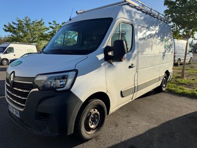 the white van is parked on the side of the road