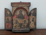 an old wooden box with a painting on it sitting on a table