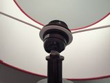 a lamp that is on a table in a room