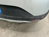 a close up of a car ' s bumper with a sticker on it