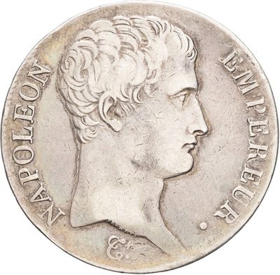 a close up of a silver coin with a woman ' s face