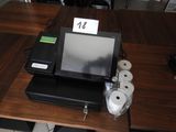 a cash register sitting on top of a wooden table