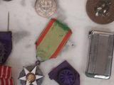 many medals and medals on a marble counter top