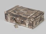an old suitcase with a lock on it on a white surface